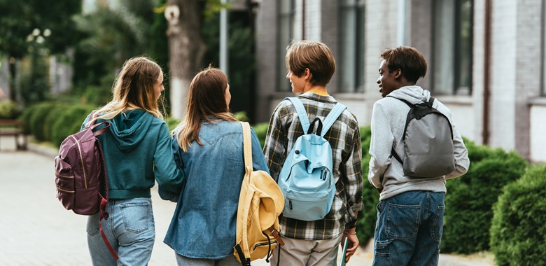 42823854 Back View Of Multiethnic Teenagers With Backpacks (1)